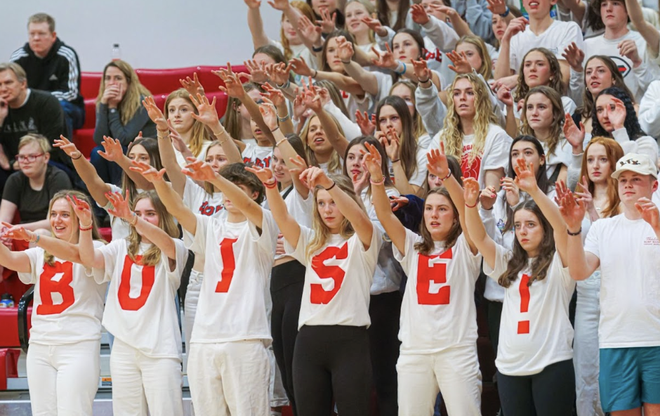 Boise High student section in white shirts spelling out BOISE