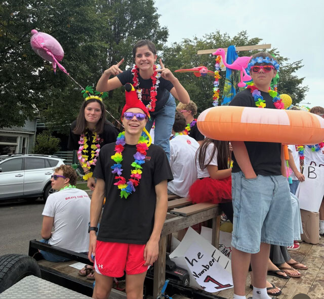 Boise High students in leis riding on a parade float